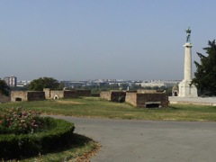 Fort at river junction, naked man statue