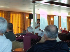 Captain addressing guests